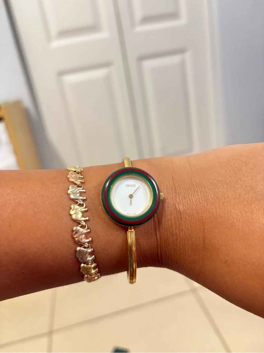 Gucci Gold-Tone Bangle Watch with Multicolor Interchangeable Bezels